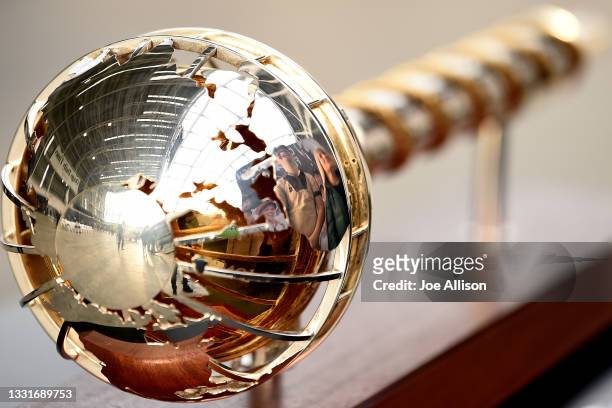 Fans pose for a photo with the ICC World Test Championship Mace during The Mace tour of New Zealand at Forsyth Barr Stadium on August 01, 2021 in...