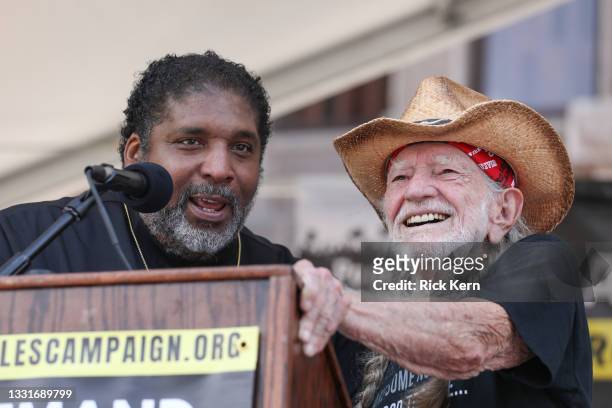 William Barber and Willie Nelson speak during The Poor People’s Campaign: A National Call for Moral Revival on the steps of the Texas State Capitol...
