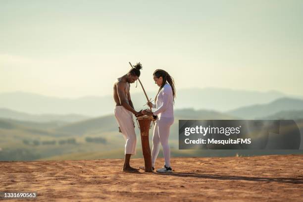 capoeira people playing musical instrument - mouth harp stock pictures, royalty-free photos & images