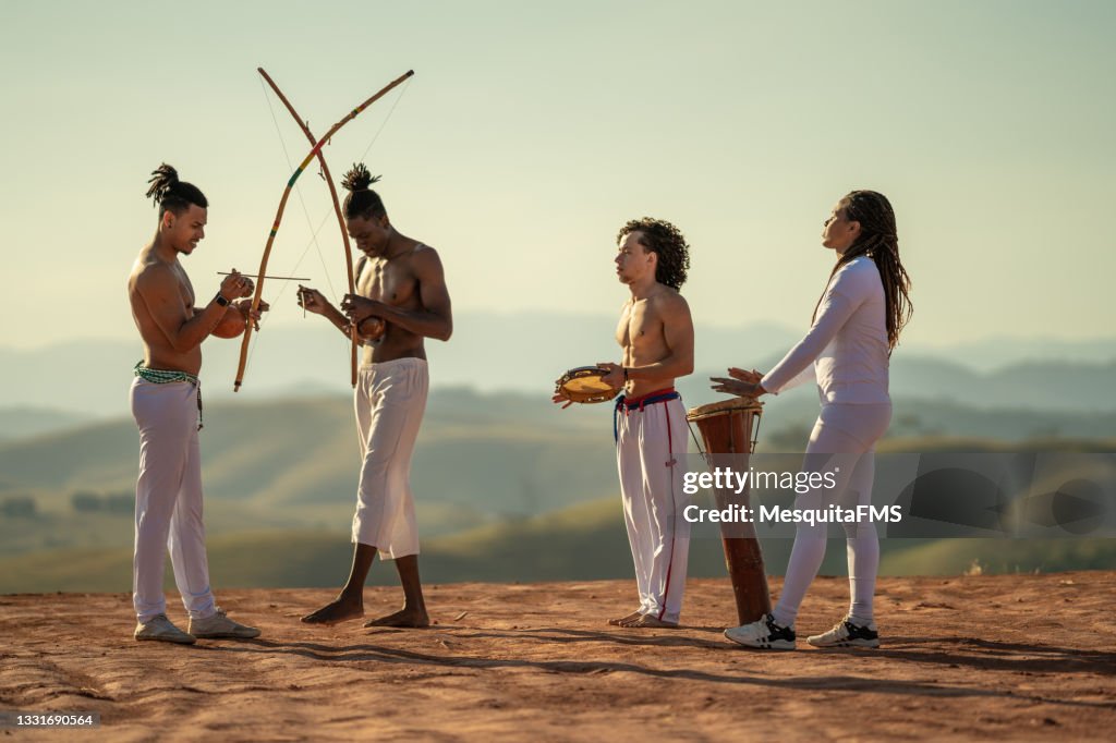 Capoeira people playing musical instrument