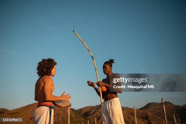 capoeira people playing musical instrument - mouth harp stock pictures, royalty-free photos & images