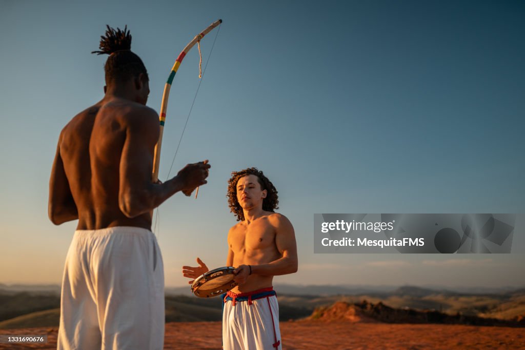 Capoeira people playing musical instrument