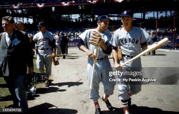 Frank Malzone and Pete Runnels of the Boston Red Sox and American League walk on the field prior to the 1959 All-Star Game against the National...