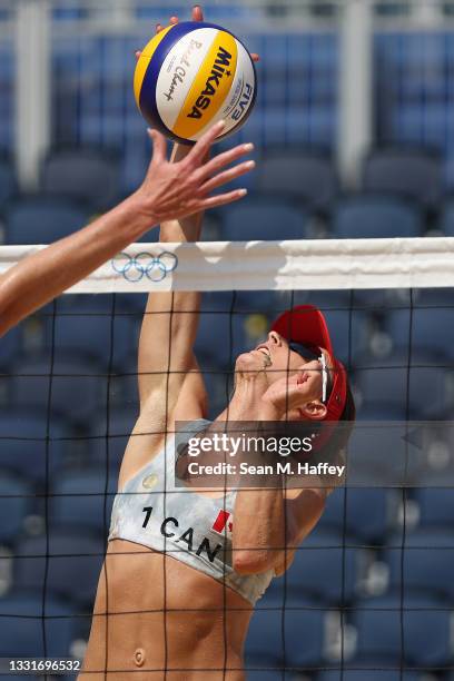 Heather Bansley of Team Canada strikes against Team United States during the Women's Round of 16 beach volleyball on day nine of the Tokyo 2020...