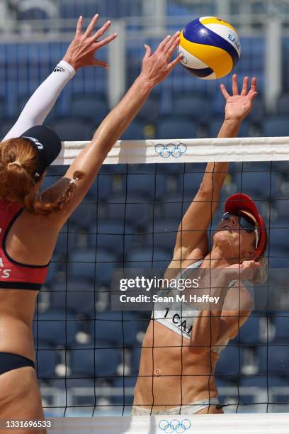 Heather Bansley of Team Canada strikes against Team United States during the Women's Round of 16 beach volleyball on day nine of the Tokyo 2020...