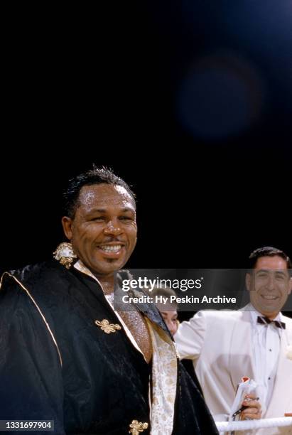 Archie Moore enters the ring prior to his 1956 Heavyweight Bout against James J. Parker, scheduled for 15-rounds on July 25, 1956 at the Toronto...