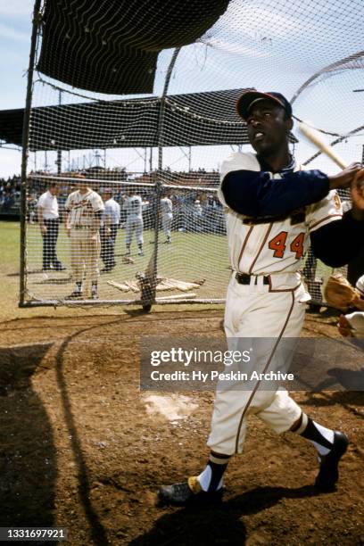 Hank Aaron of the Milwaukee Braves swings at the pitch during an MLB Spring Training game against the New York Yankees circa March, 1958 in...