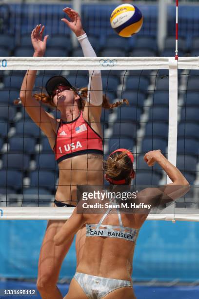 Heather Bansley of Team Canada hits past Kelly Claes of Team United States during the Women's Round of 16 beach volleyball on day nine of the Tokyo...