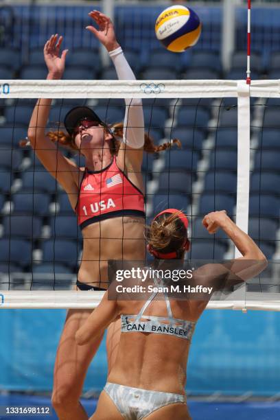 Heather Bansley of Team Canada hits past Kelly Claes of Team United States during the Women's Round of 16 beach volleyball on day nine of the Tokyo...