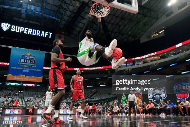 Greg Oden of the Aliens dunks the ball past Amir Johnson of the Trilogy during BIG3 - Week Four at the American Airlines Center on July 31, 2021 in...