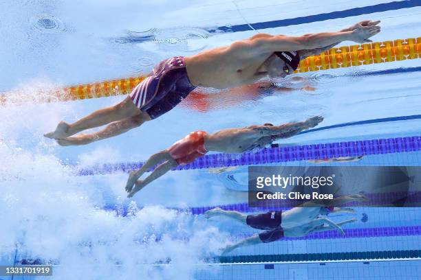 Caeleb Dressel of Team United States, Bruno Fratus of Team Brazil and Benjamin Proud of Team Great Britain compete in the Men's 50m Freestyle Final...