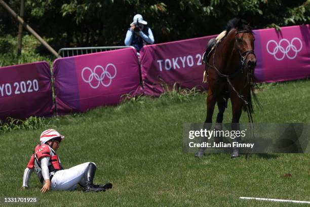 Yoshiaki Oiwa of Team Japan riding Calle 44 falls during the Eventing Cross Country Team and Individual on day nine of the Tokyo 2020 Olympic Games...