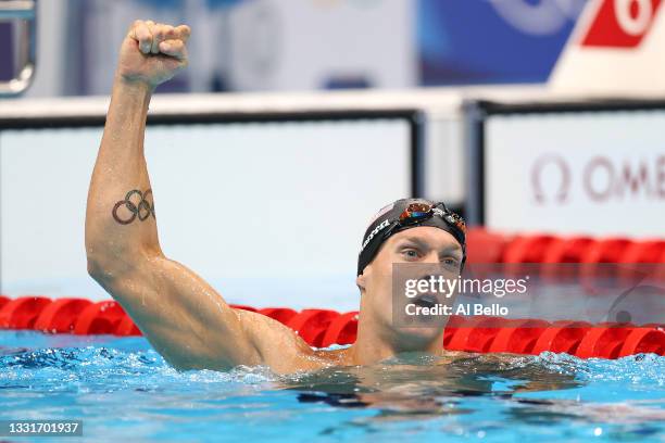 Caeleb Dressel of Team United States reacts after winning the gold medal and breaking the olympic record in the Men’s 50m Freestyle Final on day nine...