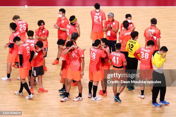 Team Japan react after winning the Men's Preliminary Round Group B handball match between Portugal and Japan on day nine of the Tokyo 2020 Olympic...