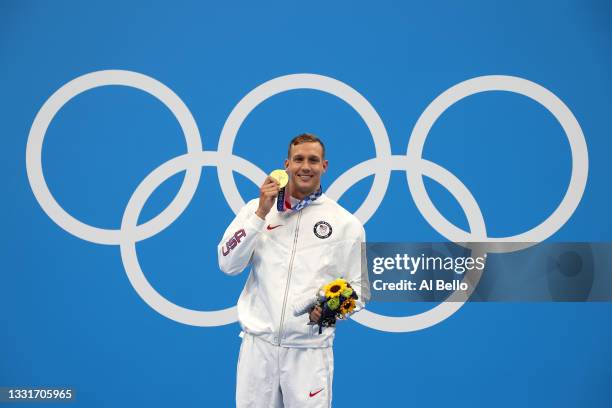 Gold medalist Caeleb Dressel of Team United States poses with the gold medal for the Men's 50m Freestyle Final on day nine of the Tokyo 2020 Olympic...