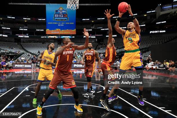 Rashard Lewis of the 3 Headed Monsters attempts a layup while being guarded by Mickell Gladness of the Bivouac during BIG3 - Week Four at the...