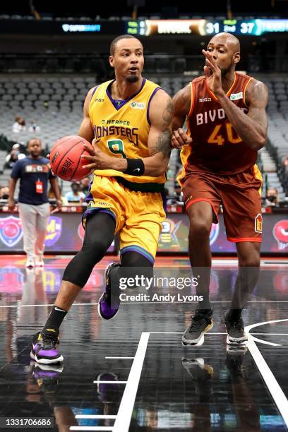 Rashard Lewis of the 3 Headed Monsters dribbles the ball while being guarded by Mickell Gladness of the Bivouac during BIG3 - Week Four at the...