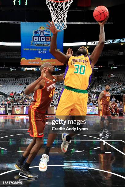 Reggie Evans of the 3 Headed Monsters attempts a shot while being guarded by Mickell Gladness of the Bivouac during BIG3 - Week Four at the American...