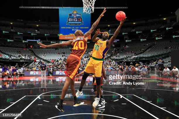 Reggie Evans of the 3 Headed Monsters attempts a shot while being guarded by Mickell Gladness of the Bivouac during BIG3 - Week Four at the American...