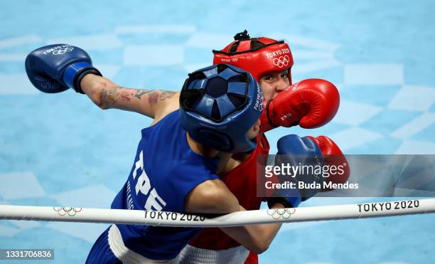 Nina Radovanovic of Team Serbia exchanges punches with Hsiao Wen Huang of Team Chinese Taipei during the Women's Fly quarter final on on day nine of...