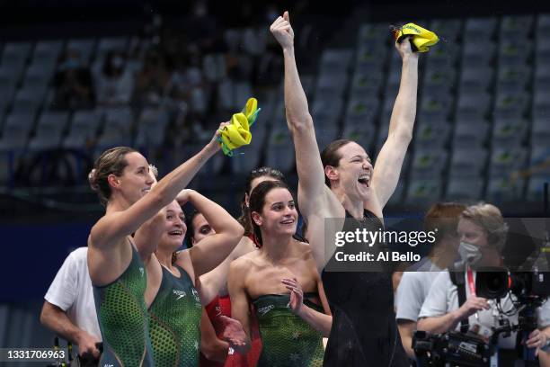 Emma McKeon, Chelsea Hodges, Kaylee McKeown and Cate Campbell of Team Australia react after winning the gold medal and breaking the olympic record...