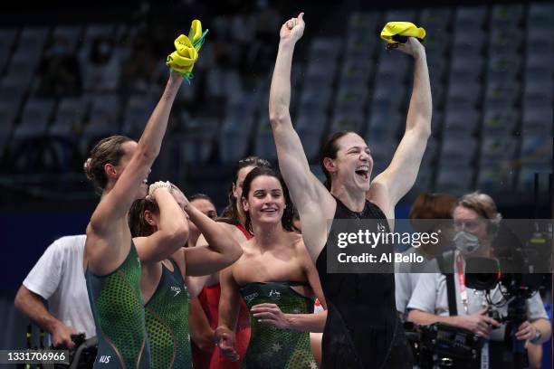 Emma McKeon, Chelsea Hodges, Kaylee McKeown and Cate Campbell of Team Australia react after winning the gold medal and breaking the olympic record...