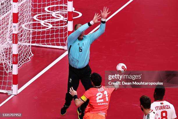 Remi Anri Doi of Team Japan shoots for goal as Humberto Gomes of Team Portugal looks to save during the Men's Preliminary Round Group B handball...