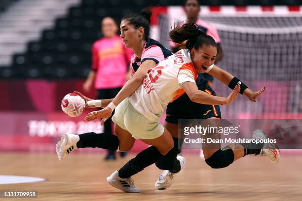 Lara Gonzalez Ortega of Team Spain battles for the ball with Viktoria Lukacs of Team Hungary during the Women's Preliminary Round Group B handball...