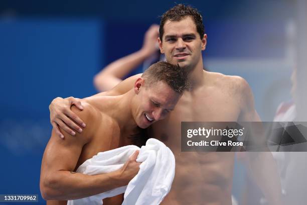 Caeleb Dressel and Michael Andrew of Team United States react after winning the gold medal and breaking the world record in the Men's 4 x 100m Medley...