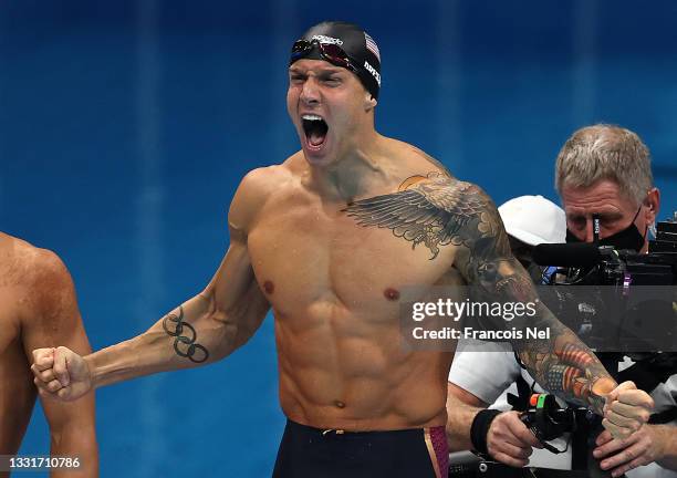 Caeleb Dressel of Team United States reacts after his team wins the gold medal and sets a new world record in Men's 4 x 100m Medley Relay on day nine...
