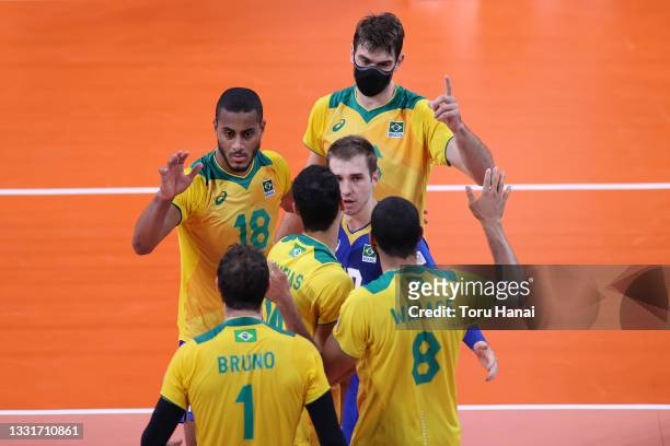 Lucas Saatkamp of Team Brazil celebrates with teammates against Team France during the Men's Preliminary Round - Pool B volleyball on day nine of the...