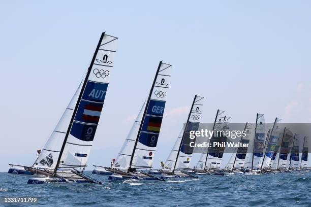 The Nacra 17 Foiling class head out to compete on day nine of the Tokyo 2020 Olympic Games at Enoshima Yacht Harbour on August 01, 2021 in Fujisawa,...