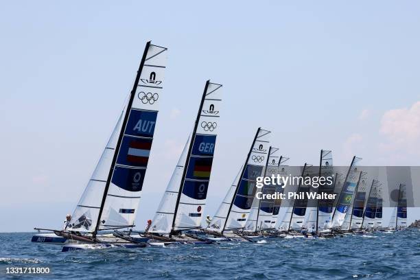 The Nacra 17 Foiling class head out to compete on day nine of the Tokyo 2020 Olympic Games at Enoshima Yacht Harbour on August 01, 2021 in Fujisawa,...