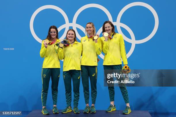 Gold medalist Kaylee McKeown, Chelsea Hodges, Emma McKeon and Cate Campbell of Team Australia pose on the podium during the medal ceremony for the...