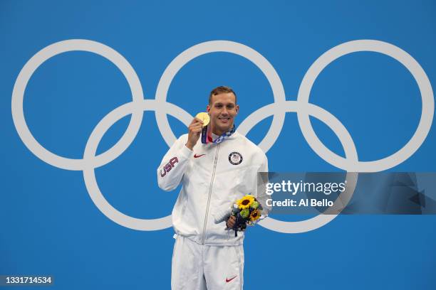Gold medalist Caeleb Dressel of Team United States poses with the gold medal for the Men's 50m Freestyle on day nine of the Tokyo 2020 Olympic Games...