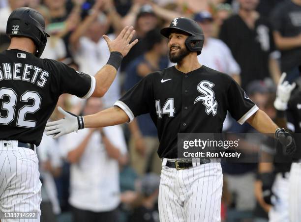 Seby Zavala of the Chicago White Sox celebrates with teammates after hitting the second of three home runs on the night in the fourth inning against...
