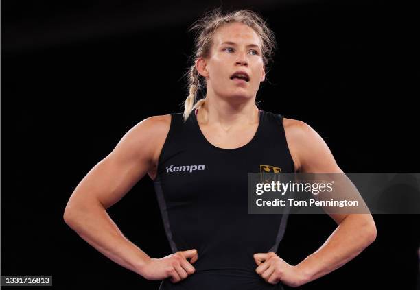 Aline Rotter Focken of Team Germany celebrates defeating Qian Zhou of Team China during the Women's Freestyle 76kg Quarter Final on day nine of the...