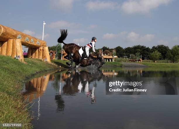 Arinadtha Chavatanont of Team Thailand riding Boleybawn Prince falls at the Sanctuary water jump on day nine of the Tokyo 2020 Olympic Games at Sea...