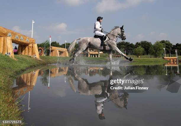 Oliver Townend of Team Great Britain riding Ballaghmor Class clears a jump during the Eventing Cross Country Team and Individual on day nine of the...