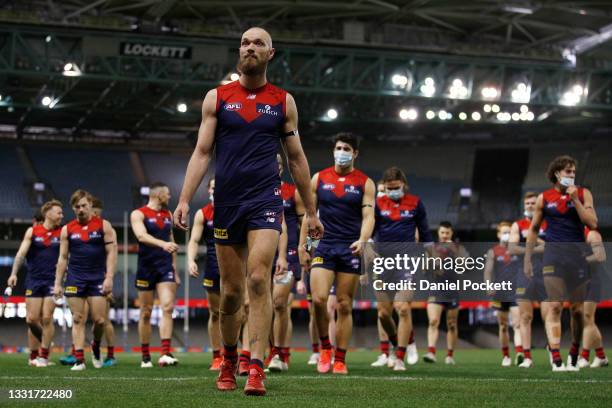 Max Gawn of the Demons leads his team off the field after winning the round 20 AFL match between Gold Coast Suns and Melbourne Demons at Marvel...