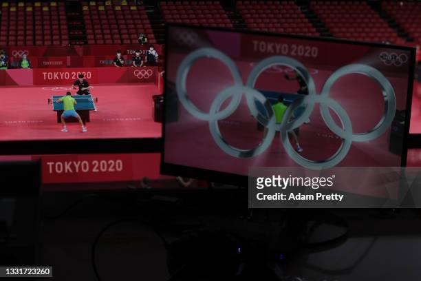 The Olympic logo seen on a television screen during his Men's Team Round of 16 table tennis match on day nine of the Tokyo 2020 Olympic Games at...