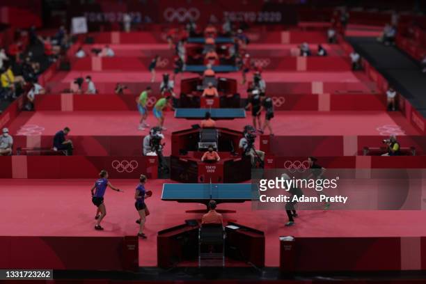Players from Romania and Egypt compete during her Women's Team Round of 16 table tennis match on day nine of the Tokyo 2020 Olympic Games at Tokyo...