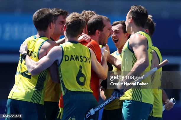 Andrew Lewis Charter and Matthew Dawson of Team Australia and teammates celebrate after winning the penalty shootout after the Men's Quarterfinal...