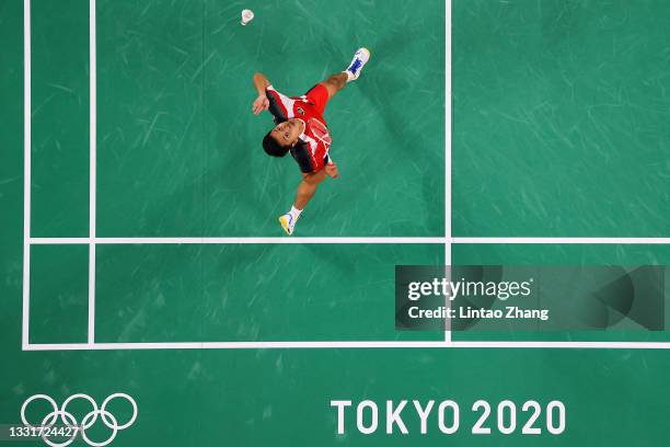 Anthony Sinisuka Ginting of Team Indonesia competes against Chen Long of Team China during a Men's Singles Semi-final match on day nine of the Tokyo...