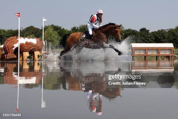 Toshiyuki Tanaka of Team Japan riding Talma D'Allou clears a jump during the Eventing Cross Country Team and Individual on day nine of the Tokyo 2020...