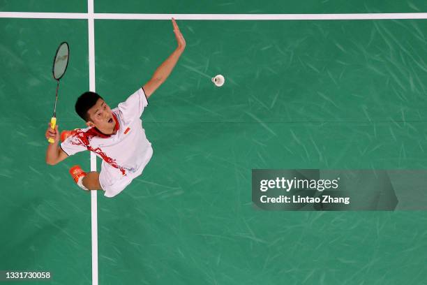 Chen Long of Team China competes against Anthony Sinisuka Ginting of Team Indonesia during a Men's Singles Semi-final match on day nine of the Tokyo...