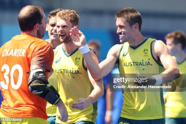 Andrew Lewis Charter of Team Australia celebrates winning a penalty shootout with teammates after the Men's Quarterfinal match between Australia and...
