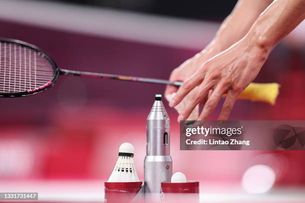 Chen Long of Team China takes a new shuttlecock as he competes against Anthony Sinisuka Ginting of Team Indonesia during a Men's Singles Semi-final...