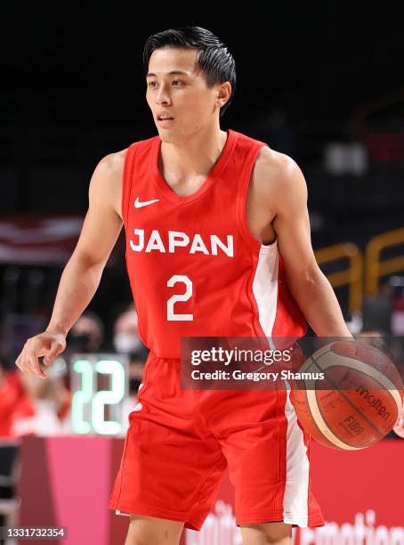 Yuki Togashi of Team Japan prepares to drive to the basket against Team Argentina during the first half of a Men's Basketball Preliminary Round Group...
