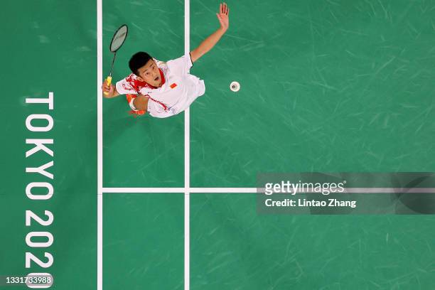 Chen Long of Team China competes against Anthony Sinisuka Ginting of Team Indonesia during a Men's Singles Semi-final match on day nine of the Tokyo...